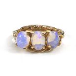 A 10ct yellow gold ring set three graduated opals,ring size K 1/2,2.6 gms,