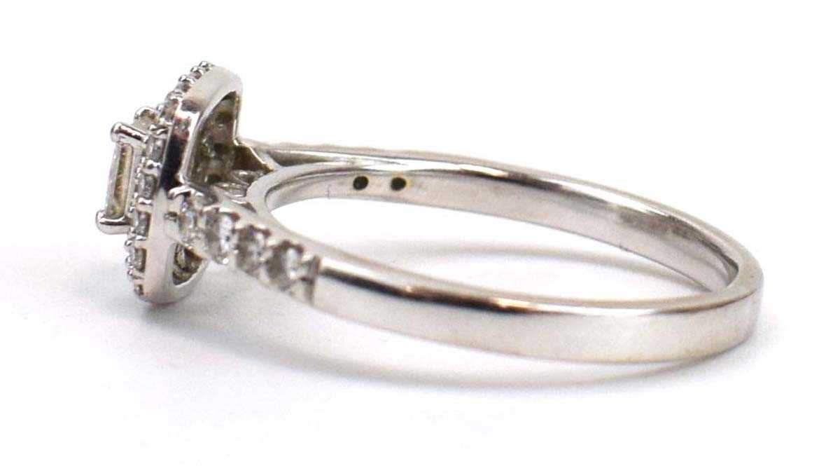 An 18ct white gold halo ring set centrally with a princess cut diamond within a double border of - Image 2 of 4