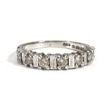 An 18ct white gold half eternity ring set seven small diamonds in illusion settings,ring size N,3.