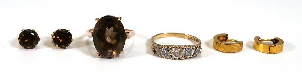 A small group of jewellery comprising a rose gold ring set smoky quartz, a pair of matching ear