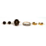 A small group of jewellery comprising a rose gold ring set smoky quartz, a pair of matching ear