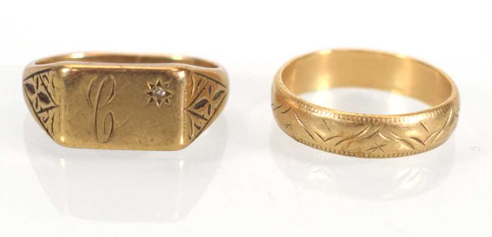 A 9ct yellow gold signet ring set small diamond and a 9ct yellow gold engraved band ring, both