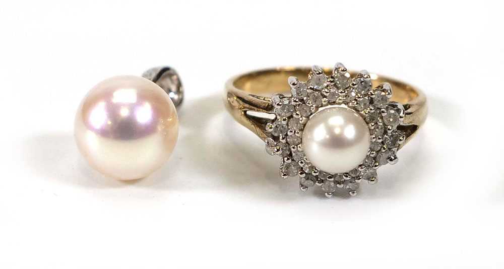 A 9ct yellow gold cluster ring set cultured pearl within a border of small diamonds, ring size K,