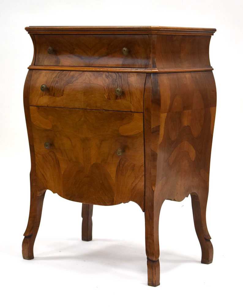 A Lysberg, Hansen & Therp walnut and kingwood chest of bombe form, the three drawers fitted to