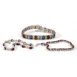 Three silver multi gem tennis-type bracelets set garnet, ruby and other coloured stones (3)