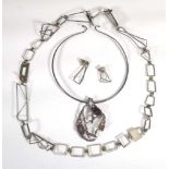 A silver openwork necklace of modernist cubist design, l. 78 cm and a pair of matching ear pendants,