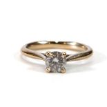 An 18ct yellow gold ring set brilliant cut diamond in four claw setting.stone approx. 0.5 carats,