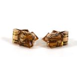 A pair of 14ct yellow and rose gold ear clips, each set emerald cut golden citrine, l. 1.8 cm, 11.