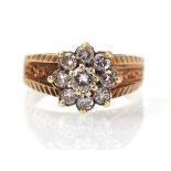A 9ct yellow gold cluster ring set nine small diamonds in a bark design setting, ring size N, 3 gms