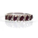 A white metal half eternity ring set six marquise shaped rubies and twelve small diamonds, ring size