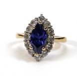 A 14ct yellow gold cluster ring set tanzanite coloured marquise shaped stone within a border of