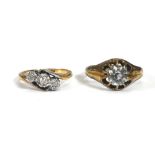 An 18ct yellow gold crossover ring set three small diamonds in illusion settings, ring size K 1/2,