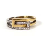 An 18ct two-colour gold ring set small diamonds in an interlocking crossover setting, ring size P,