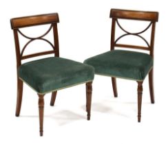 A pair of Regency mahogany occasional chairs on turned tapering front legs, the back splats with