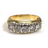 An 18ct yellow gold ring set five brilliant cut diamonds in rubover settings,ring size P,4.9 gms