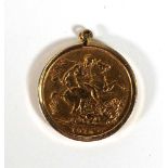 An Edwardian sovereign dated 1910 in a loose 9ct mount, overall 8.9 gms