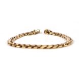 A 9ct yellow gold curblink bracelet, l. 21 cm, 28.1 gms