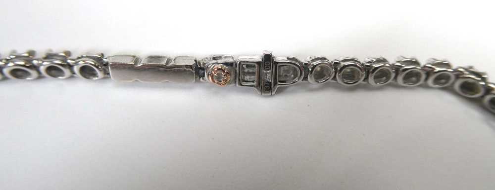A 9ct white gold tennis bracelet set small diamonds, 10.3 gmsClasp currently stuck in place and - Bild 2 aus 3