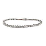 A 9ct white gold tennis bracelet set small diamonds, 10.3 gmsClasp currently stuck in place and