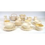 A group of Belleek ceramics including a teapot and cover, h. 12 cm, tea cups, saucers, cream jugs