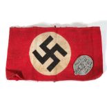 A red armband bearing the Nazi swastika together with a 1935 Day of German Labour or 'Tag Der