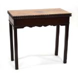 An early George III mahogany tea table with rectangular folding top and moulded edges, 75 x 82 x