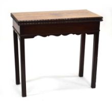 An early George III mahogany tea table with rectangular folding top and moulded edges, 75 x 82 x