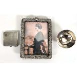 A group of silver comprising an easel back photograph frame, h. 16 cm, a compact and a small bowl,
