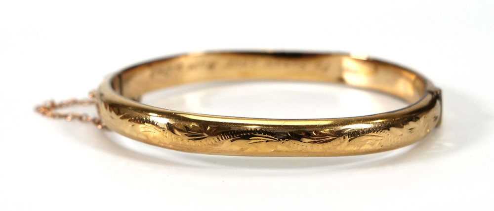 A 9ct yellow gold and engraved hinged bracelet, 8.2 gmsDents, wear and personalised engraving