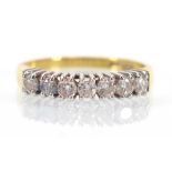 An 18ct yellow gold half eternity ring set seven small brilliant cut diamonds,ring size P,2.7 gms