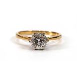 A yellow metal ring set brilliant cut diamond in a six claw setting,stone approx. 1 carat,ring