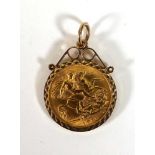 A half sovereign dated 1915 in a loose 9ct mount, overall 5.2 gms