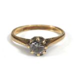 A yellow metal ring set small diamond in an eight claw setting,ring size M,1.6 gmsWell worn. Stone