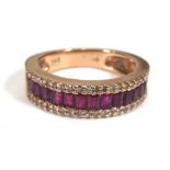 A 14ct rose gold half eternity ring set baguette cut rubies and small diamonds,ring size N 1/2,4.9