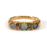 An 18ct yellow gold ring set thre graduated opals interspersed with four small diamonds, Chester
