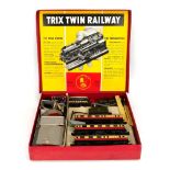A Trix Twin OO gauge passenger train set and accessories, boxedHeavily playworn