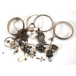 A group of silver and metalware jewellery including hinged bracelets, Christening bracelets, ear