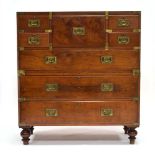 A 19th century mahogany two-section campaign chest, the secretaire flanked by two pairs of small