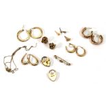 A mixed group of 9ct yellow gold and yellow metal jewellery comprising four pairs of ear hoops, a