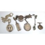 A group of silver and metalware jewellery comprising a locket necklace, an American dollar pendant