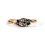 An 18ct yellow gold and platinum highlighted crossover ring set small diamond and two sapphires,ring