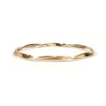 A 9ct yellow gold twist design bangle, internal d. 6.2 cm, 11.9 gms