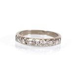 An 18ct white gold ring set seven small diamonds, ring size J 1/2, 2.9 gms