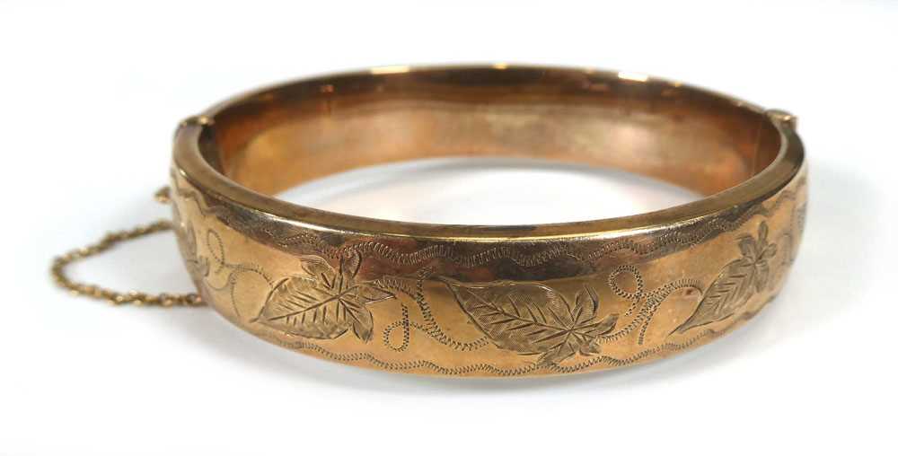 A 9ct yellow gold engraved hollow hinged bracelet, Birmingham 1972, 20.5 gms