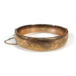 A 9ct yellow gold engraved hollow hinged bracelet, Birmingham 1972, 20.5 gms