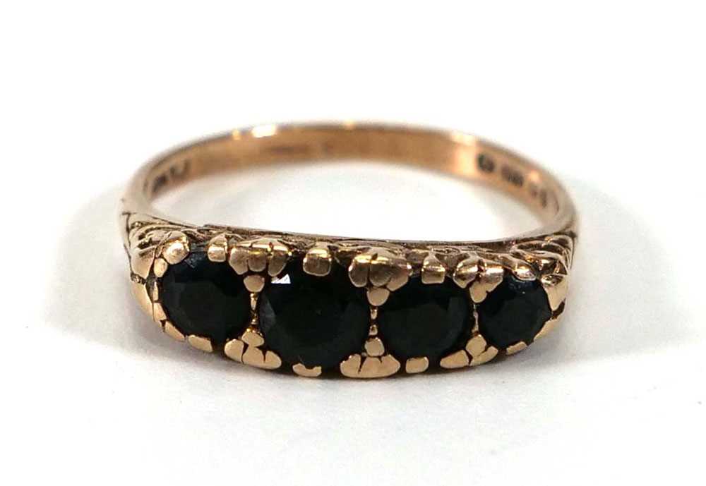 A 9ct yellow gold ring set four graduated oval sapphires,ring size L,2.3 gms