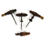 A group of three corkscrews together with a stopper surmounted by a ship (4)