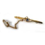 An early 20th century 15ct yellow gold bar brooch set sapphire and two seed pearls, w. 4.6 cm, 2.9