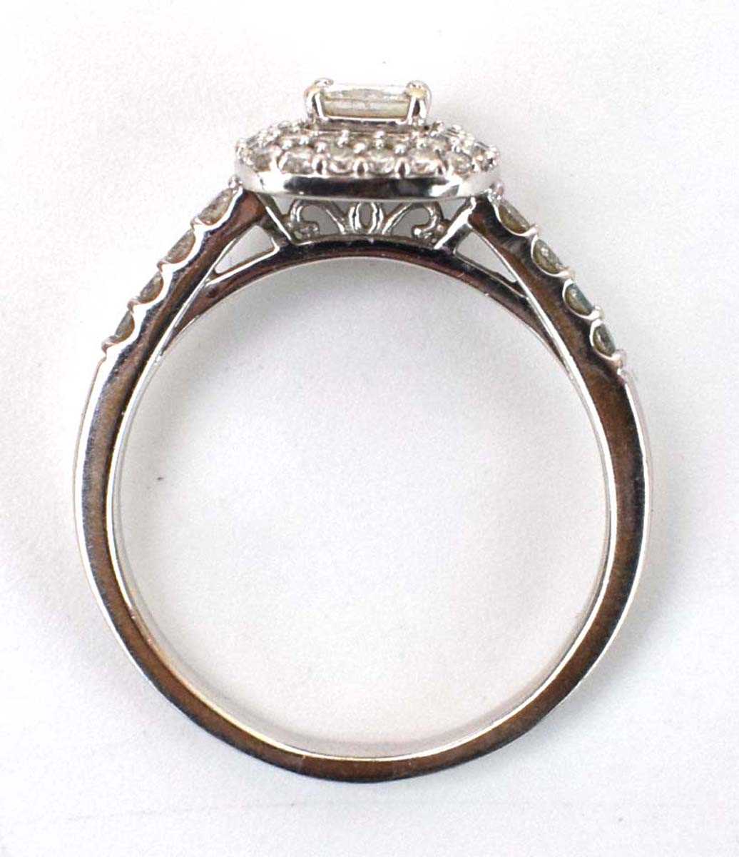 An 18ct white gold halo ring set centrally with a princess cut diamond within a double border of - Image 4 of 4