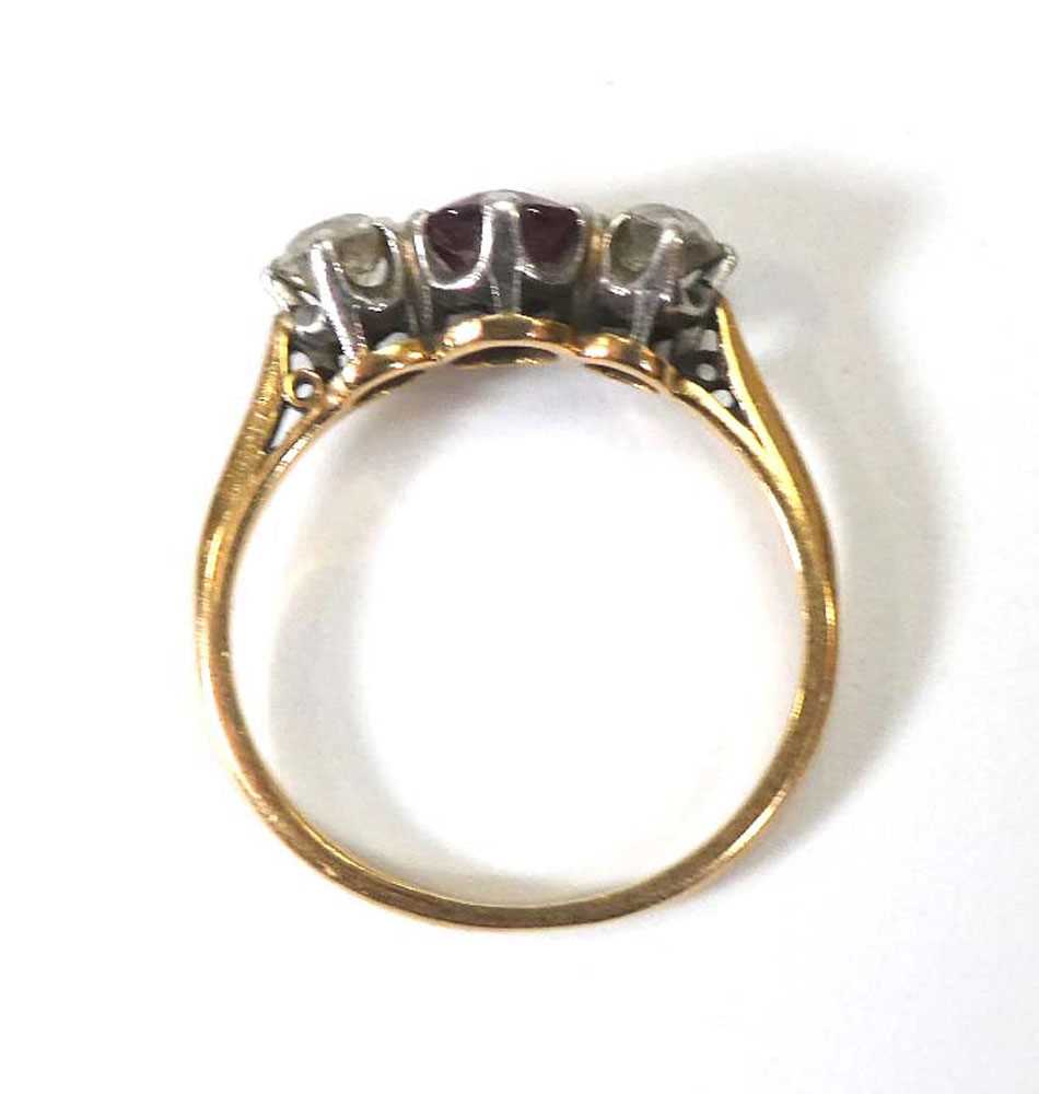 A yellow metal ring set round cut ruby and two old brilliant cut diamonds in an inline setting, - Image 4 of 4